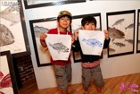 Boys show off their Gyotaku prints