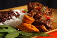 Rabo Encendido ~ select lean oxtails seasoned and cooked in red wine sauce served with arroz blanco, frijoles negros and platanos maduros - Soul De Cuba Cafe Honolulu Hawaii